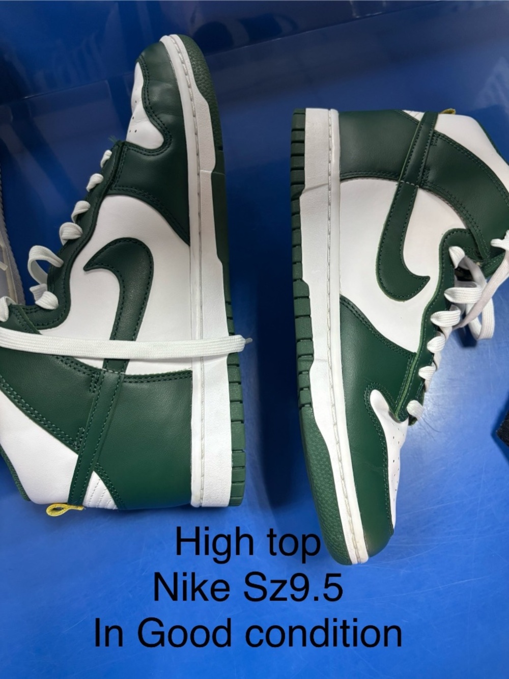 Green and white Nike
